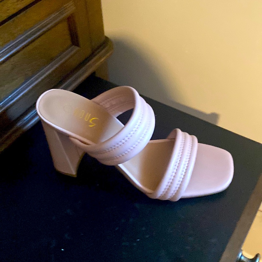 Spring heels are her. Soft pink color